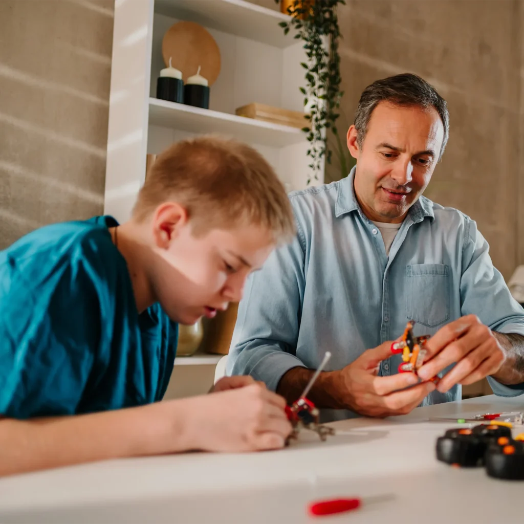 foster care worker helping foster child with project