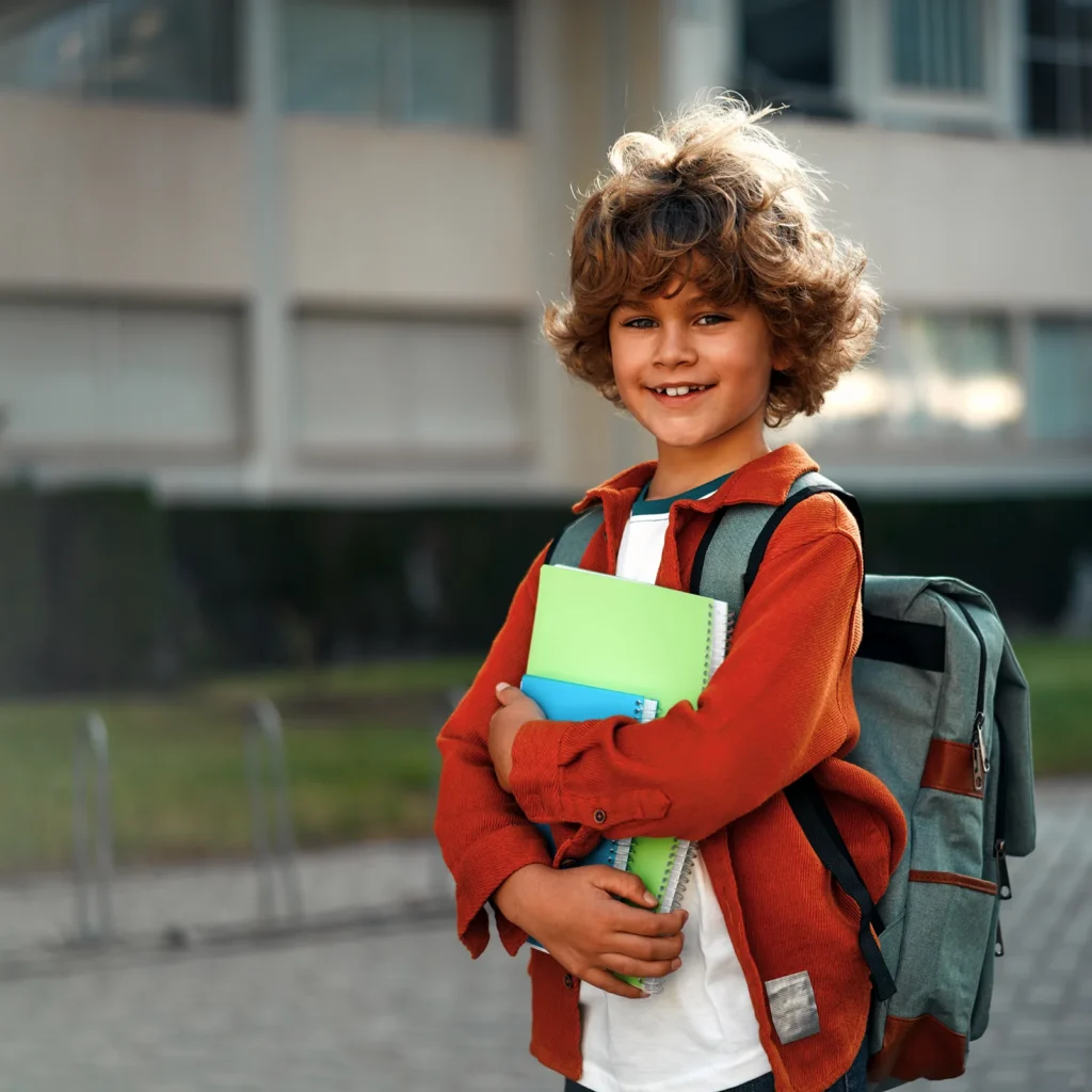 excited young kid going back to school